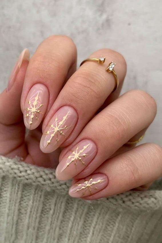 Nude with gold snowflake line art - Christmas nail design for older women