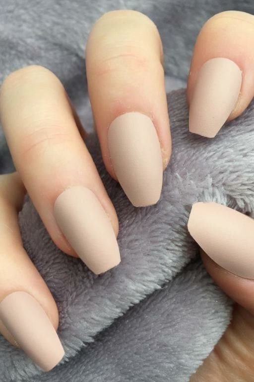 Matte nude nails on grey faux fur