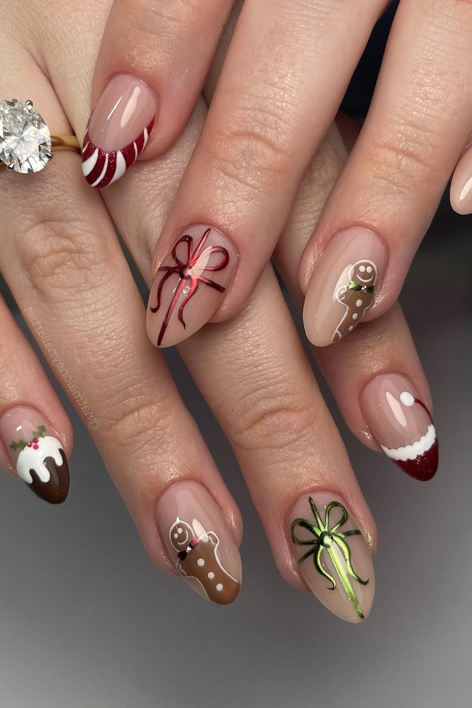 nude christmas nails with red gift bow art