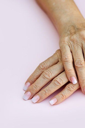 pink baby boomer fade on almond nails mature hands