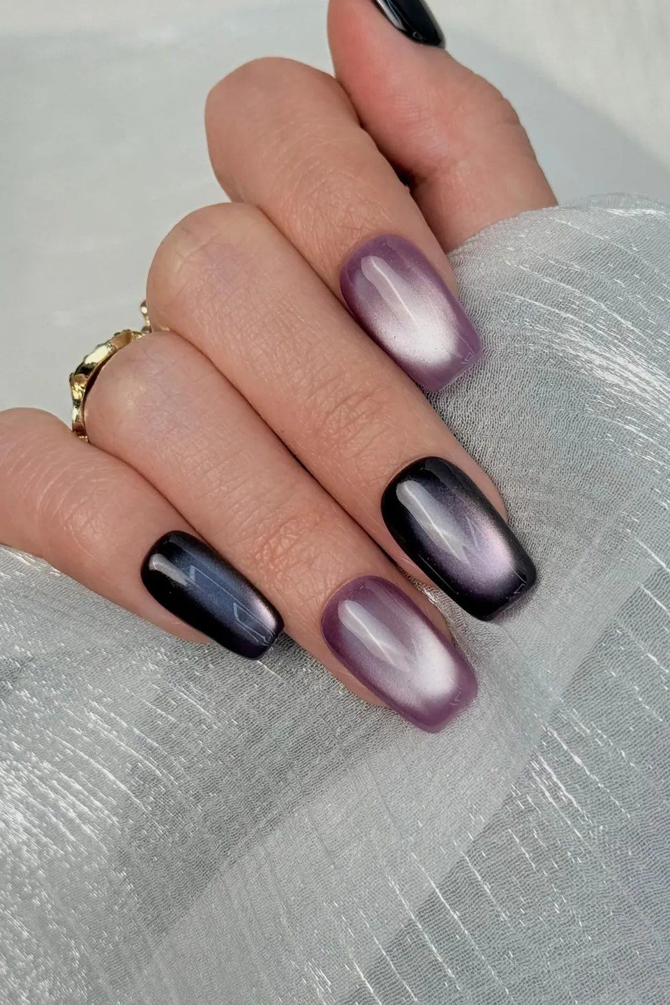 Black Purple Cat Eye Nails - Near black purple with silver gray magnetic shimmer covers these medium length squoval nails.