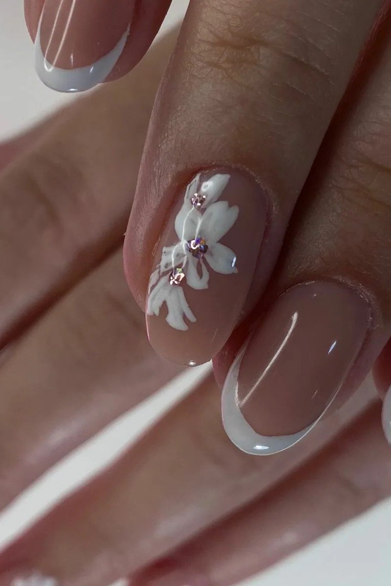 French manicure with white floral nail art