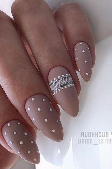 taupe almond polka dot nails with crystal band