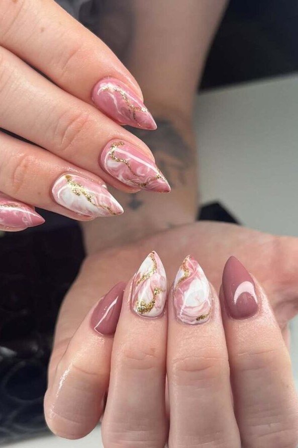Pink marble nails with gold veining