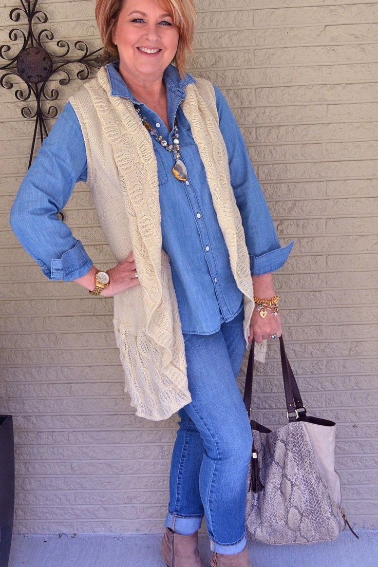 chambray shirt knit vest jeans layered fall outfit over 50