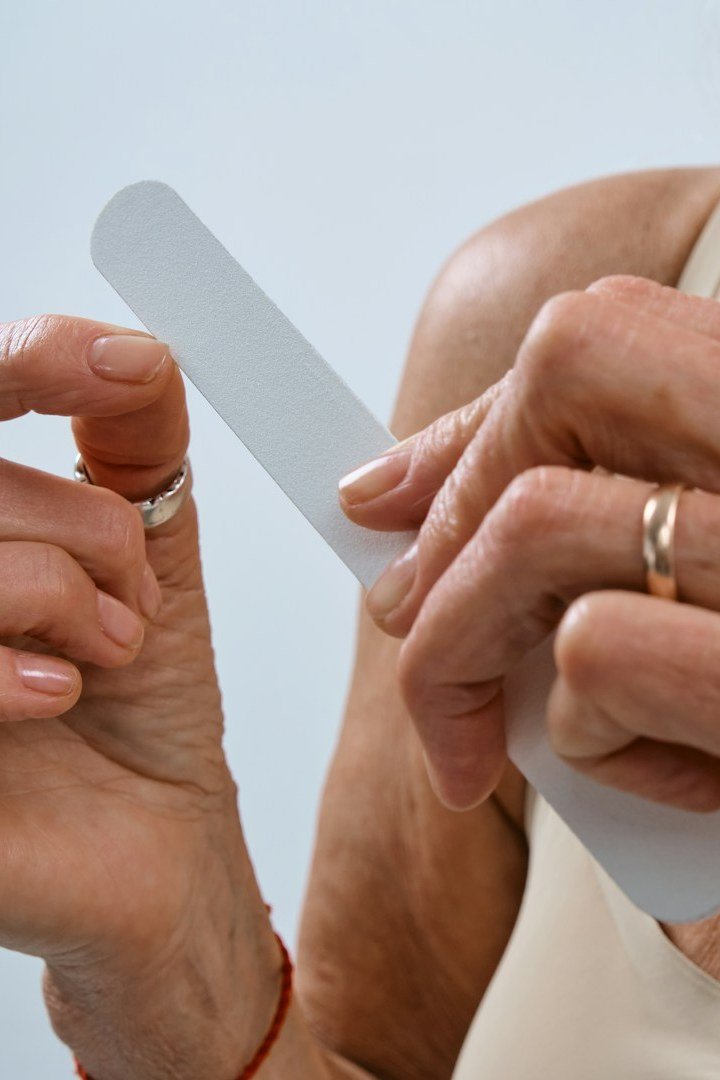 Filing mature nails on the go with a purse nail file
