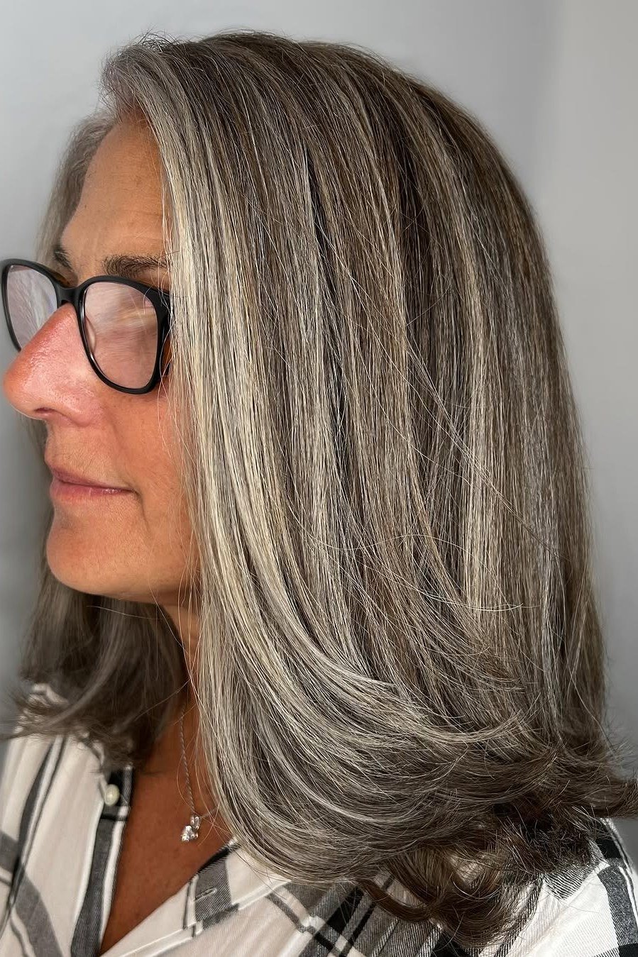 Straight Grey-Streaked Hair - timeless hairstyle for women over 60