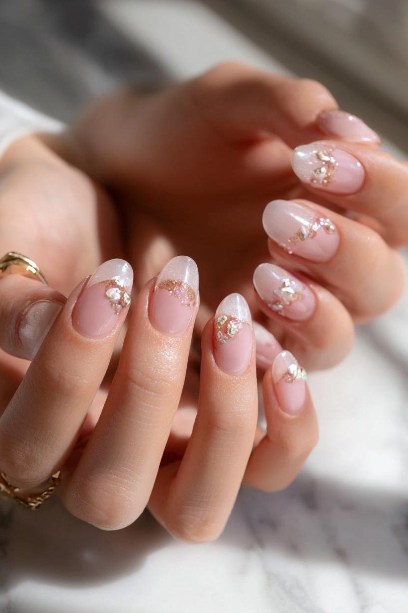 Nude nails with pearl and gem accents, sophisticated nail design for women over 50