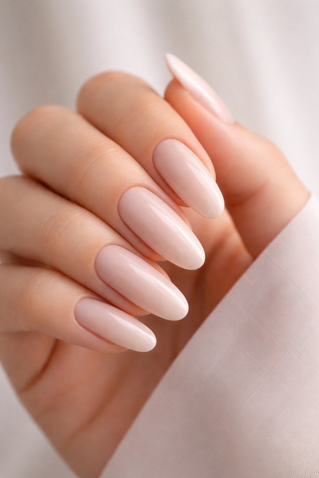 Pale Nude Almond Closeup - elegant nude nail design for women over 60