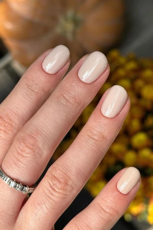 Creamy Beige Almond Nails with Pumpkins - old money fall nail color for women over 40