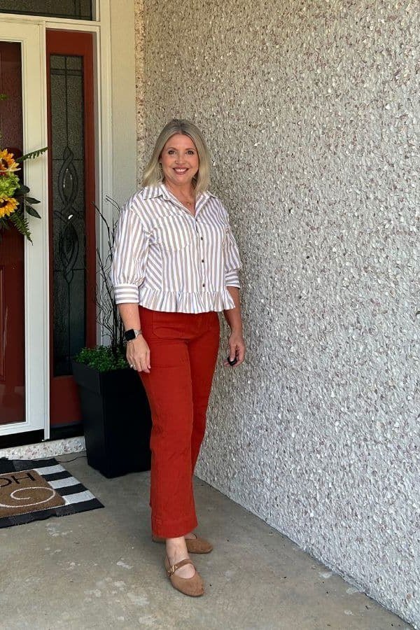 Striped Shirt with Rust-Red Trousers on a woman over 50, fall outfit idea