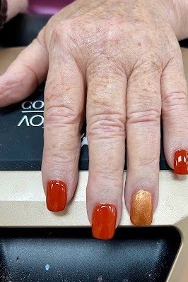 Burnt orange nails with gold accent for women over 60