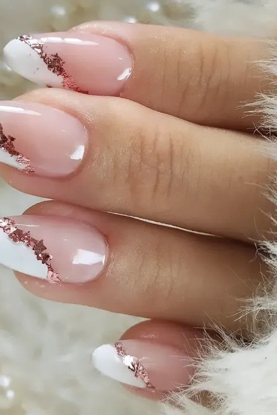 White french gel nails with rose gold glitter