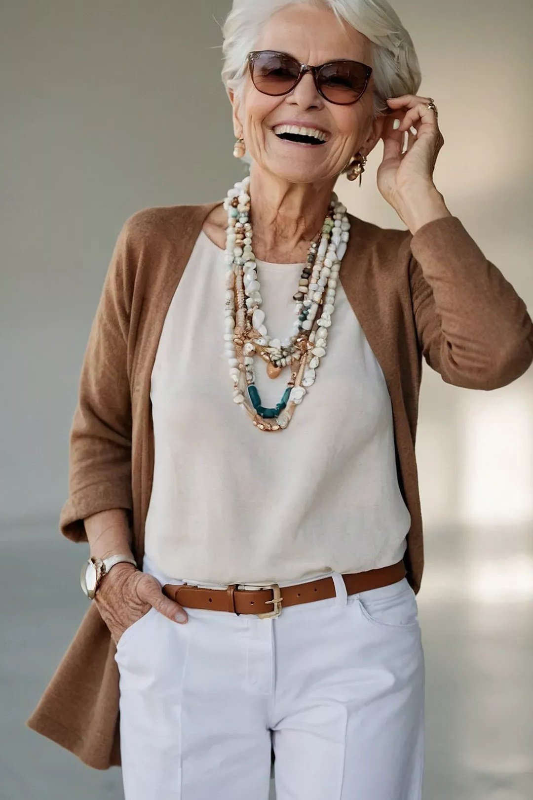 Elegant fall outfit for women over 70: brown cardigan with layered necklaces