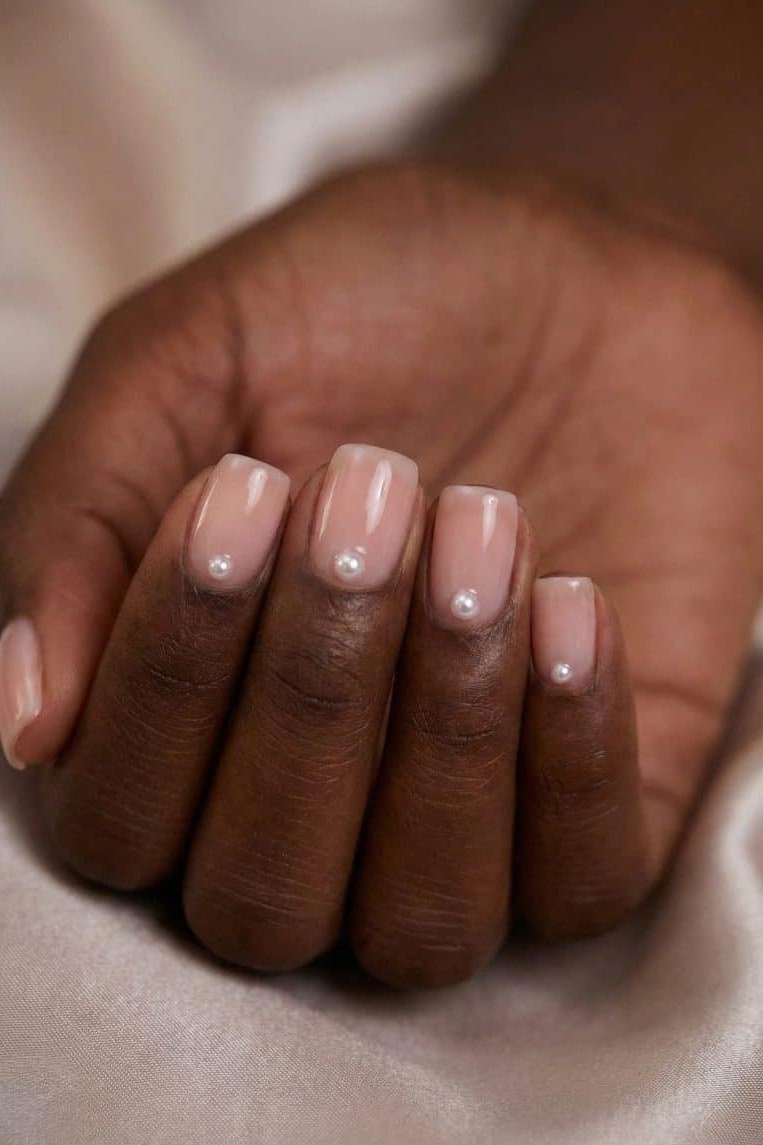 Short nude nails on deep skin tone
