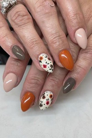 Burnt Orange Floral Fall Nails nail design for women over 40