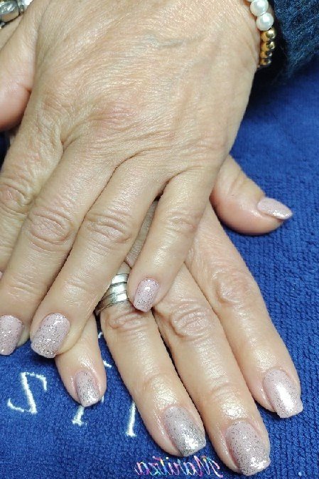 short oval, silvery glitter sparkle chrome, two mature hands on blue towel, for women over 60
