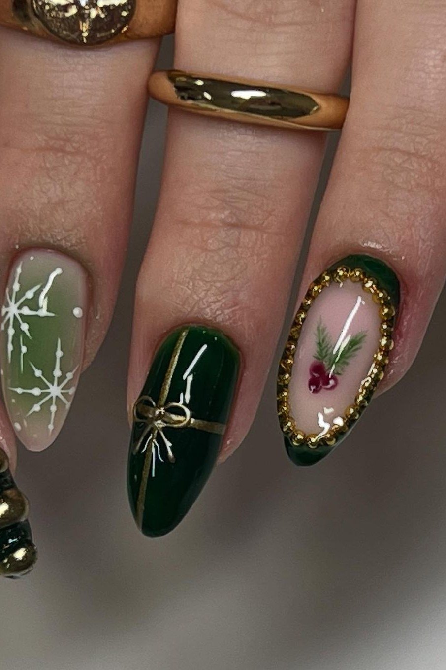 deep green christmas nails with gold detailing