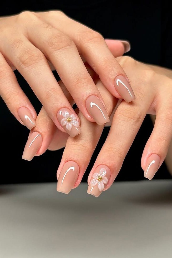 Nude Nails with Floral Accents - nude nail art idea for women over 40