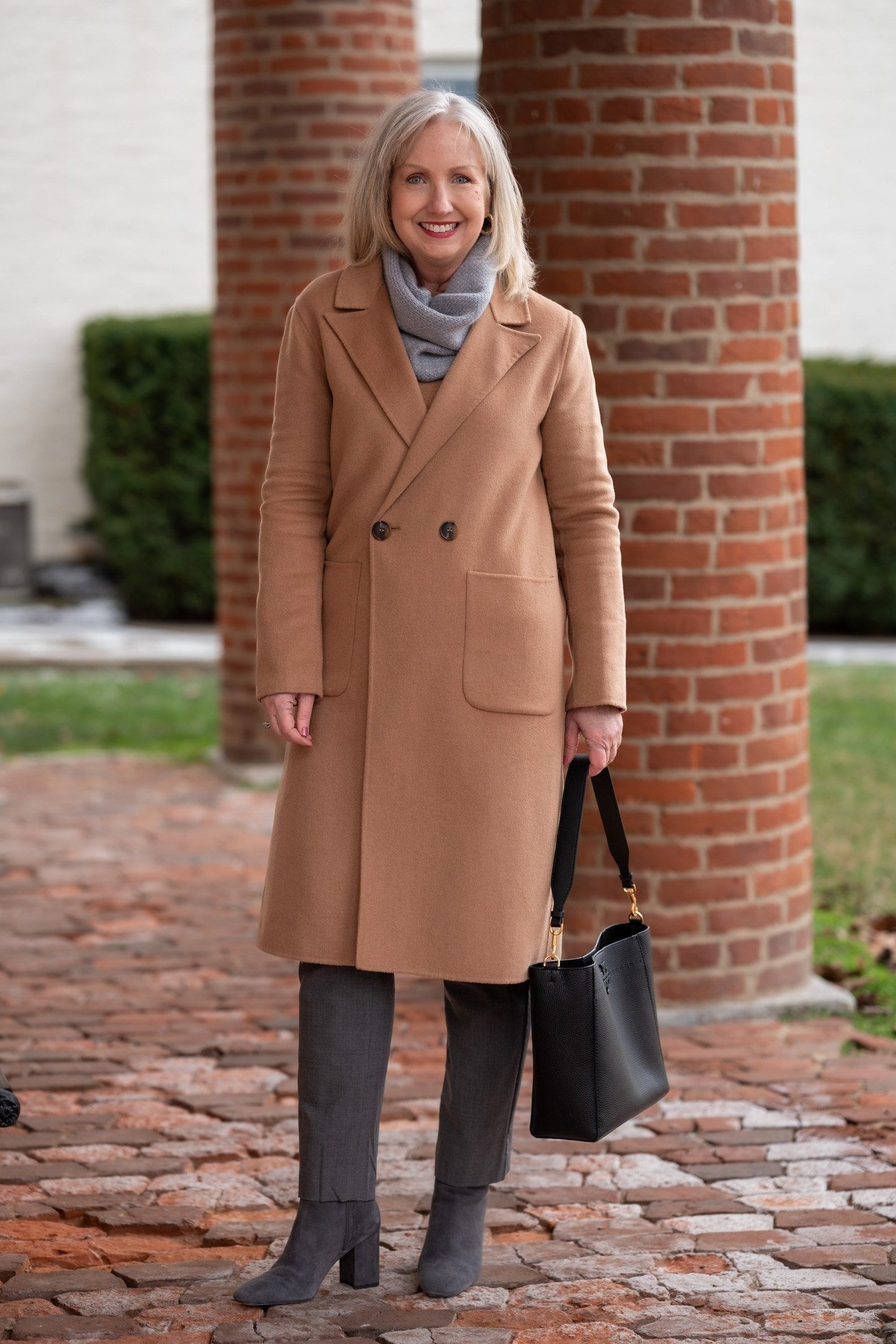 camel coat dark trousers gray scarf over 50