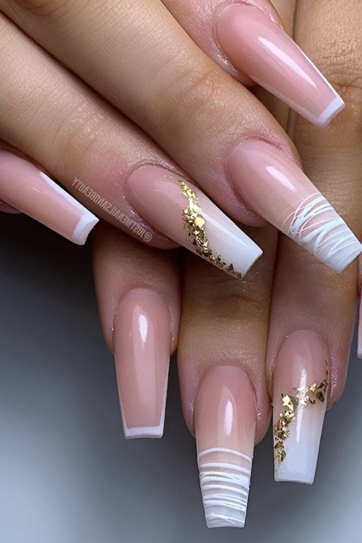 Long coffin French manicure with gold glitter accent