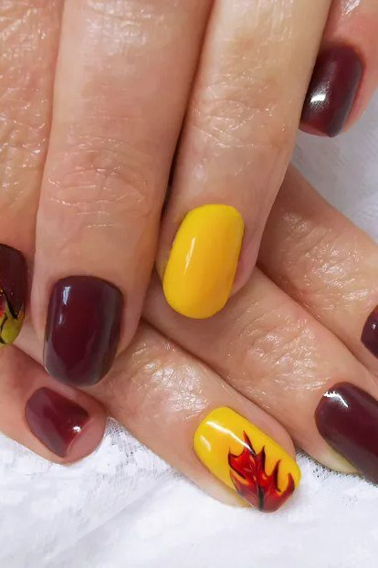 Burgundy and Mustard Fall Leaf Nails nail design for women over 40