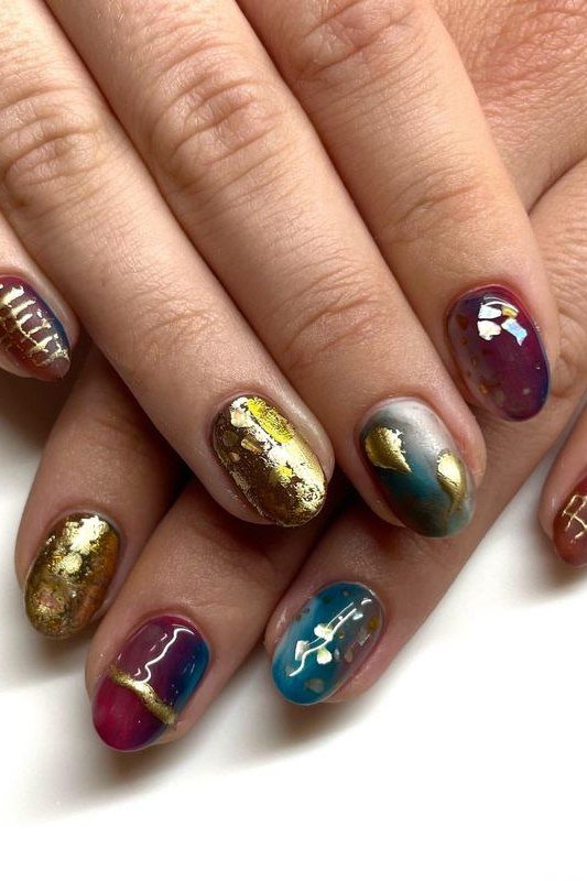 Multicolor metallic nails in gold teal purple red