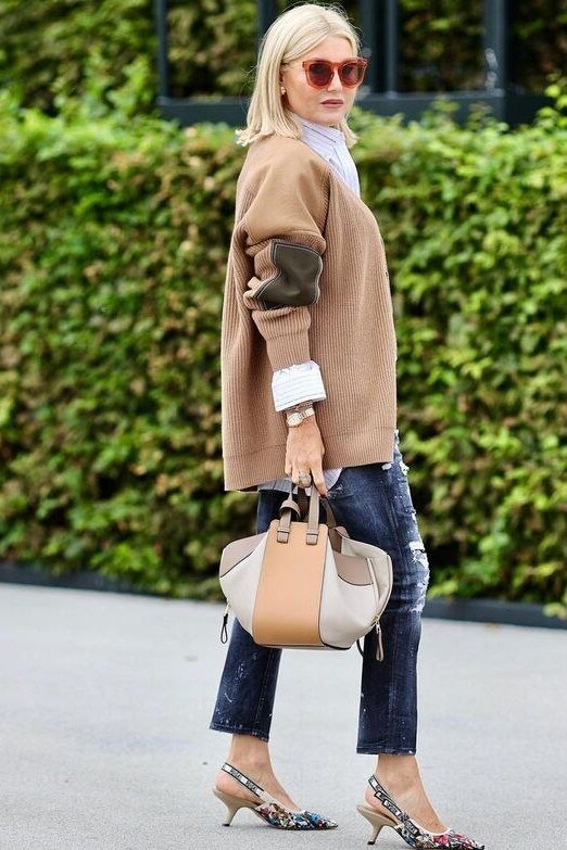 Camel sweater with distressed blue jeans and heels, weekend outfit for women over 50