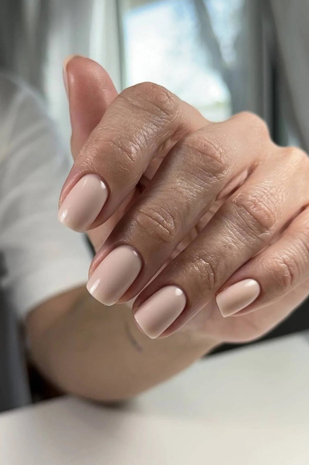 short round, matte nude, one mature hand , for women over 60