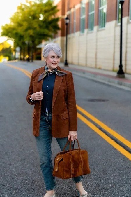 Rust suede blazer over denim shirt with jeans for women over 60