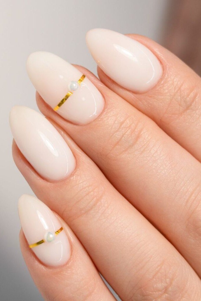 Gold Band Accent Nails - nude nail art idea for women over 40