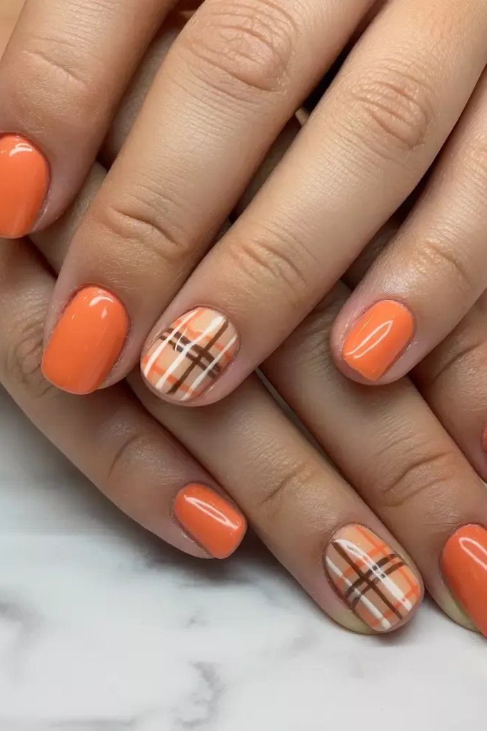 63. Burnt Orange Nails With Plaid Accents - Thanksgiving nail art idea for women over 50