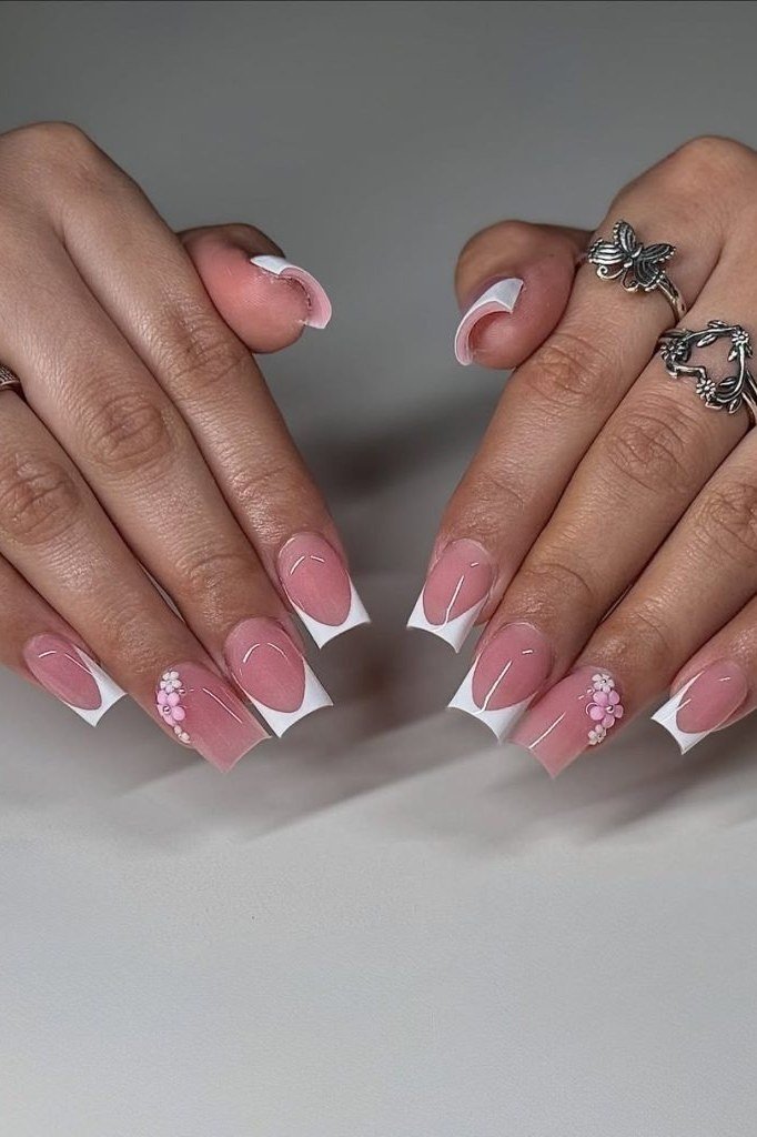 Pink and white french nails with flower nail art