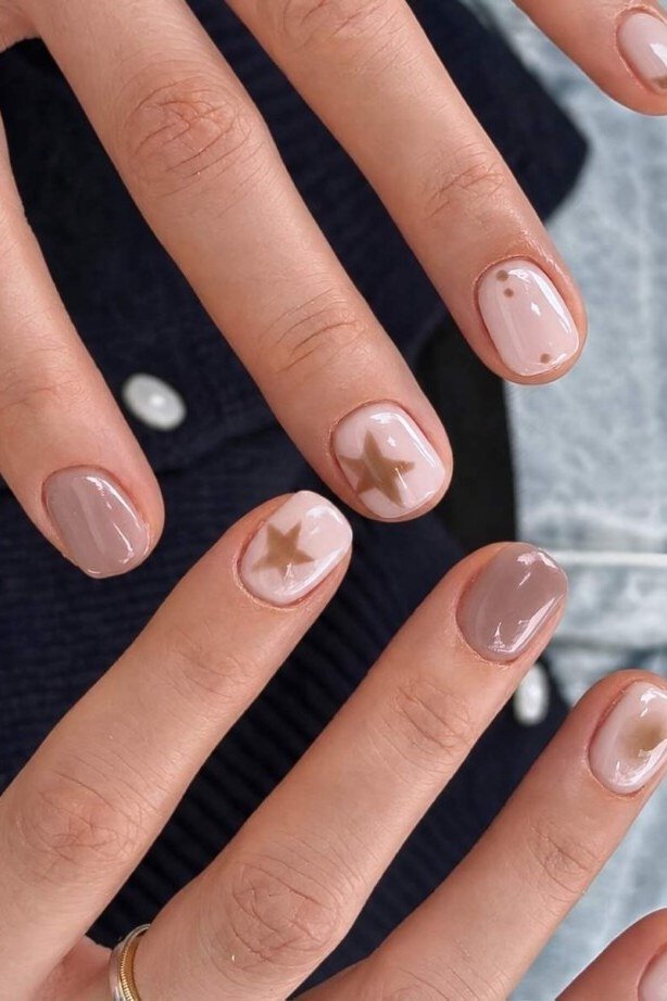 taupe nails with gold star accents