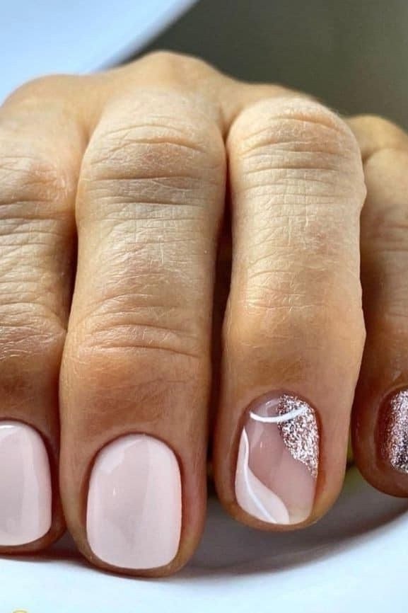 white-pink nails with a silver glitter accent for older women