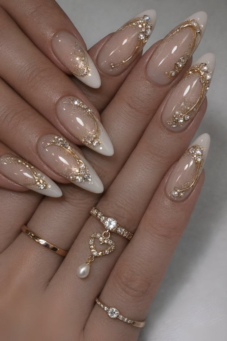 Nude nails with gold chain and rhinestone art