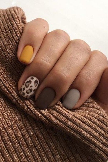Taupe matte with leopard print accent nail, short oval, rust sweater cuff, fall nail color for women over 40
