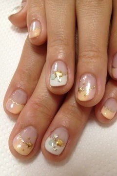 Nude ombre with tiny gold floral art, short nails, ombre nail design for women over 60