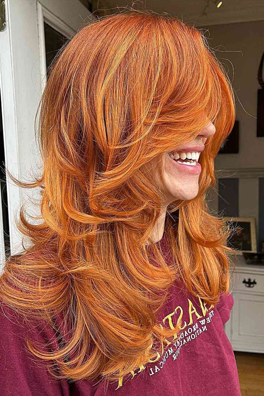 Copper-Orange Wavy Butterfly Cut - butterfly cut hairstyle for women over 60
