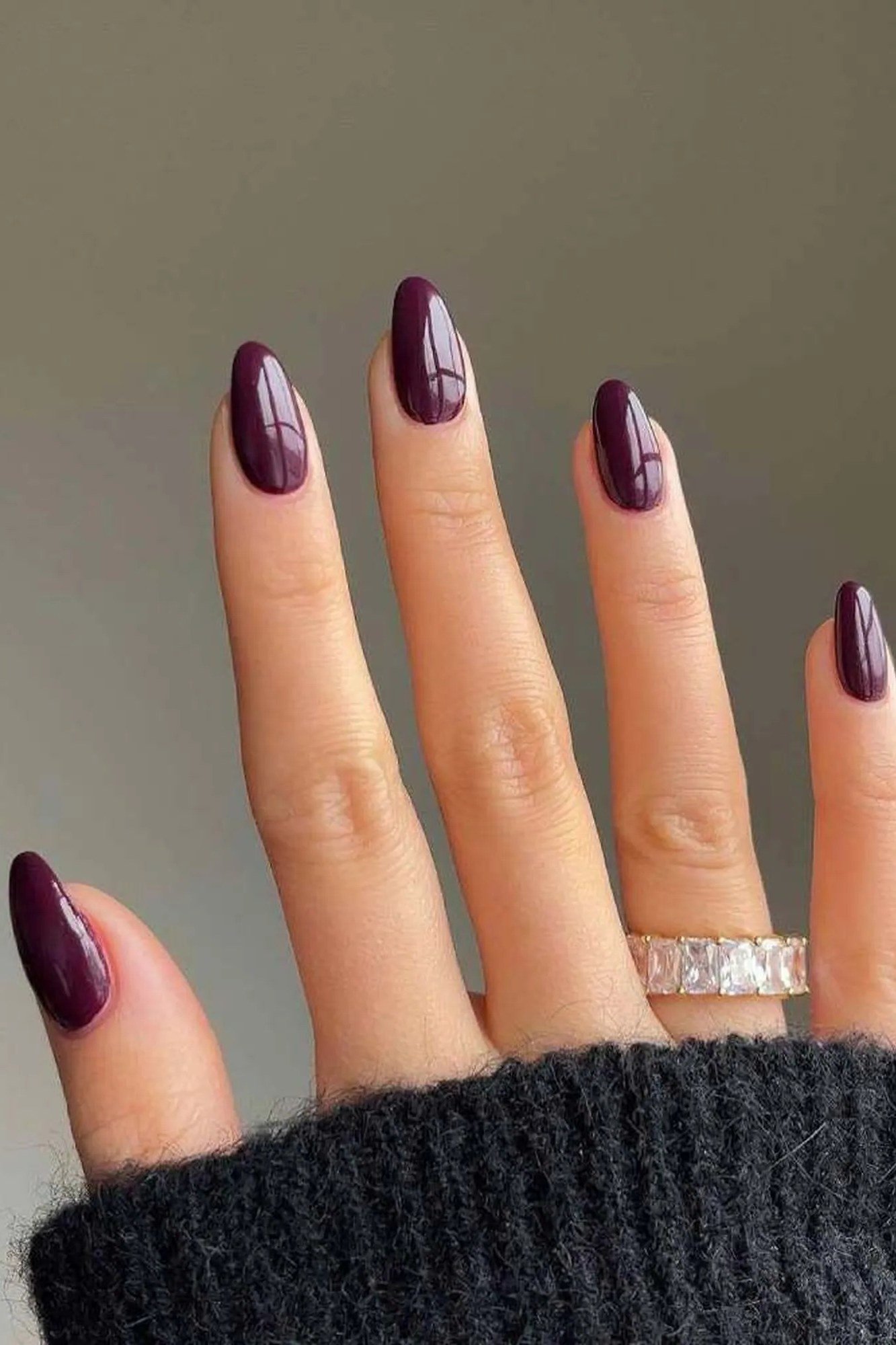 Matte burgundy almond on sweater, burgundy fall nail idea for women over 60
