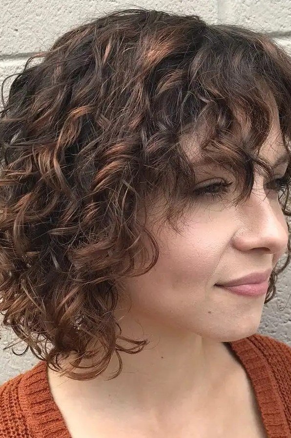 Brown curly shag side view - curly hairstyle for women over 60