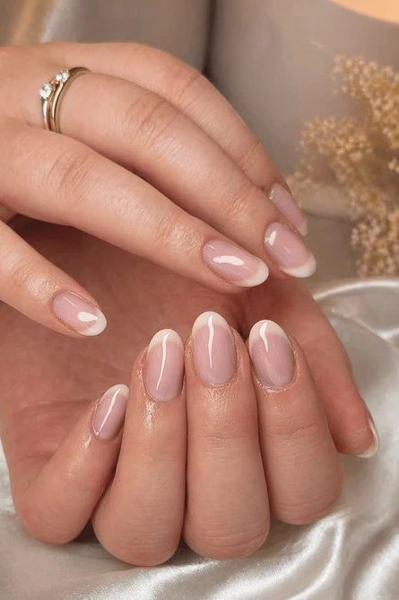 Natural French manicure on mature hands