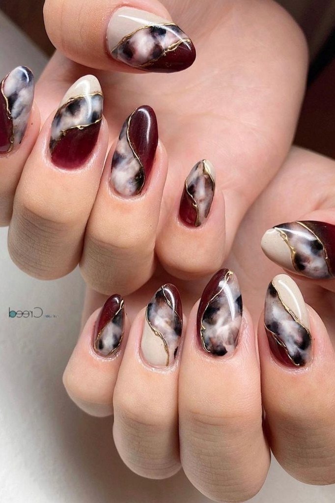 Burgundy Nails with Tortoiseshell Accents, fall nail color idea for women over 50