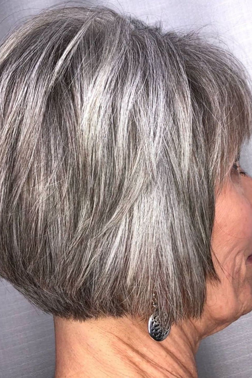 Rounded silver-grey french bob with tucked-under ends