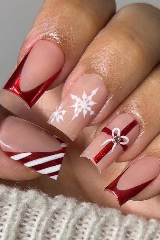nude nails with red chrome gift box and snowflake art
