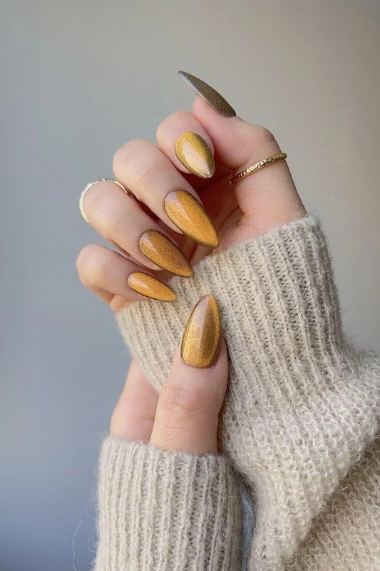 Mustard Gold Cat Eye Nails - Rich mustard gold with magnetic shimmer covers these medium length almond nails.