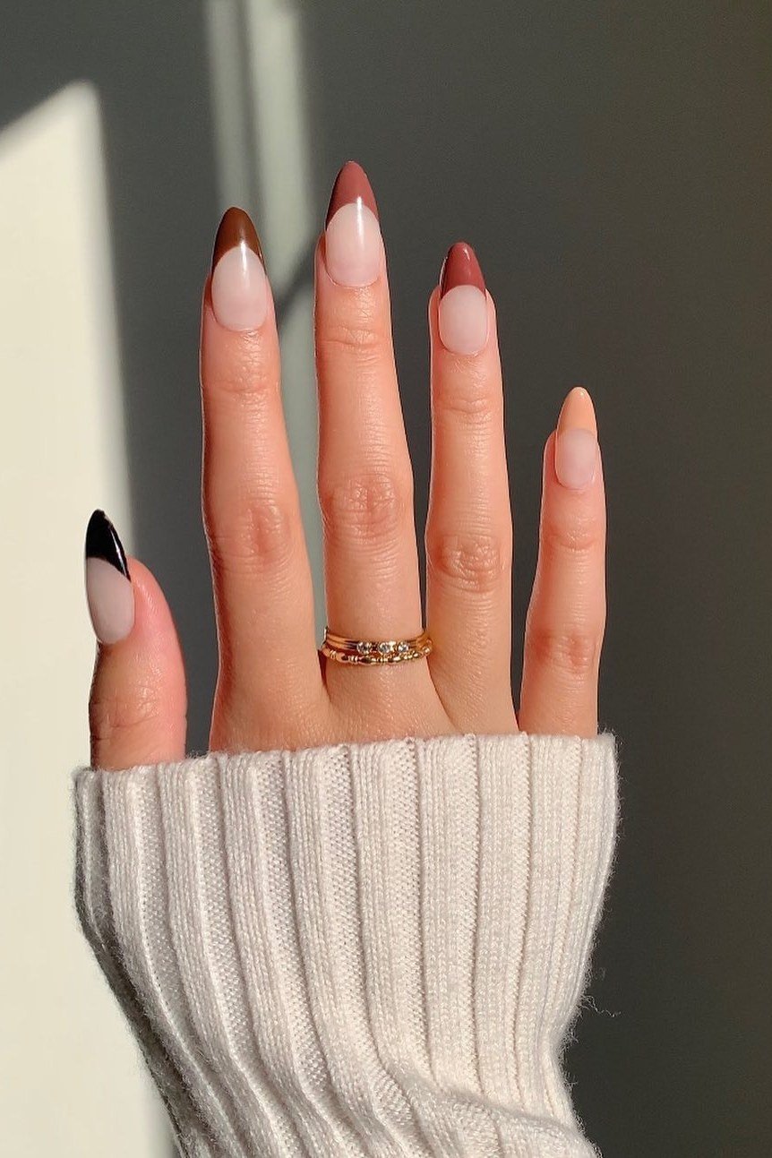 Autumn ombre french nails blending nude to burnt orange tips, glossy fall gradient.