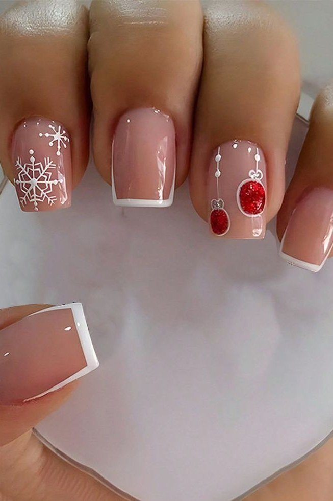 nude christmas nails with snowflake and ornament art