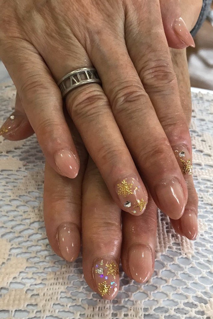 Nude with Gold Flakes on Mature Hands nail design for women over 40