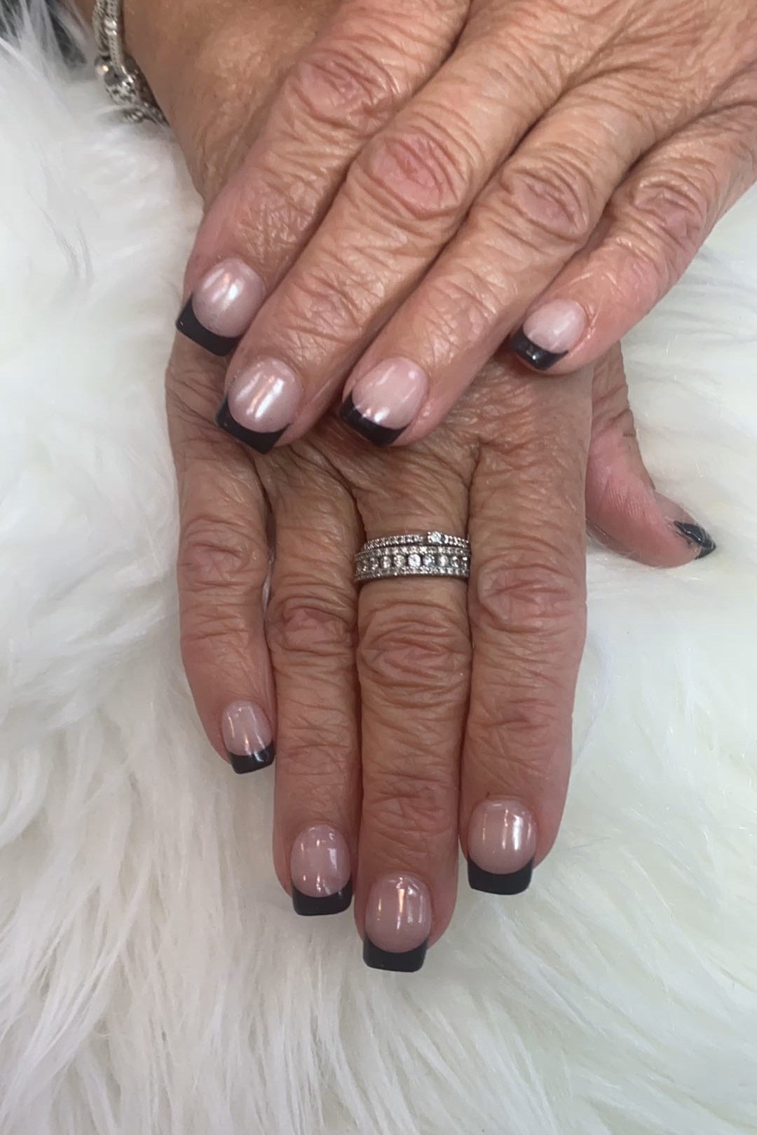 Nude nails with black french tips